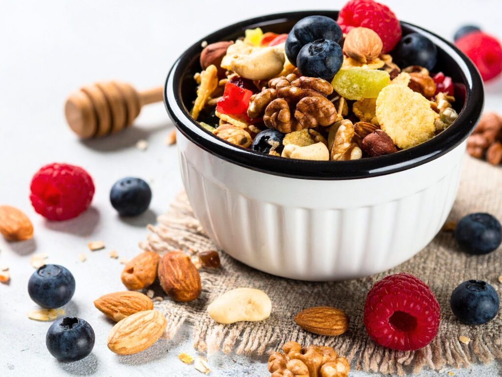granola with nuts and berries - high fiber high protein snacks